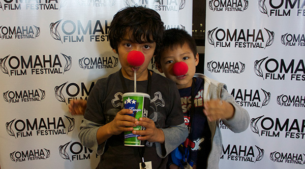 Our sons wearing clown noses at the Omaha Film Festival.