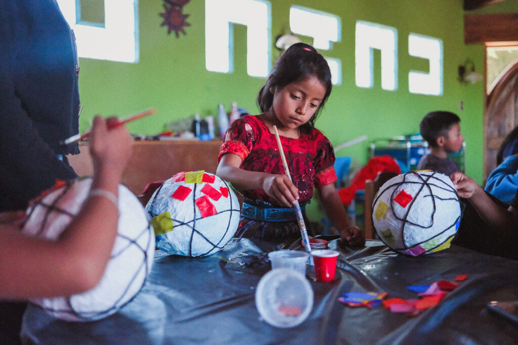 Opal House Summer 25 Preschool Workshop students working on their lanterns.