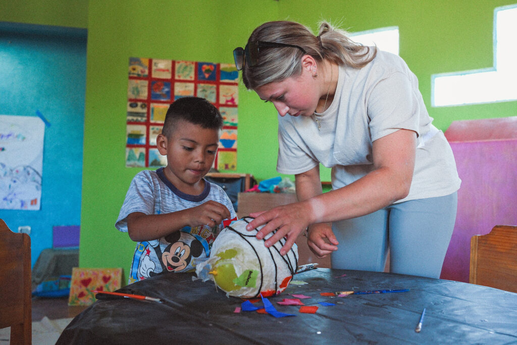 Opal House Summer 25 Preschool Workshop leaders, Anna Long working with a student.