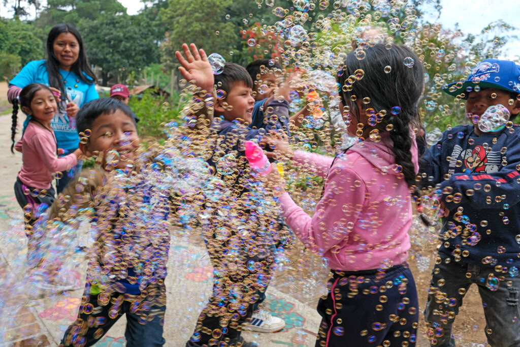 Opal House Summer 25 Preschool Workshop playing with bubbles.